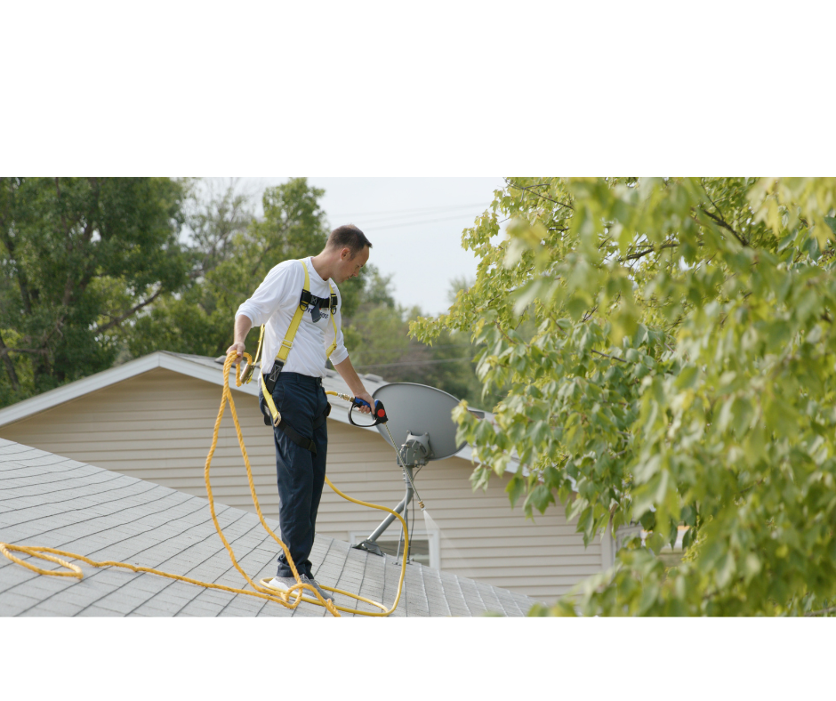 Harnessed WL3 technician treating a residential roof safely